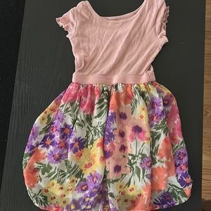 Beautiful little girls dress, pink top with flowy flower patterns at bottom.